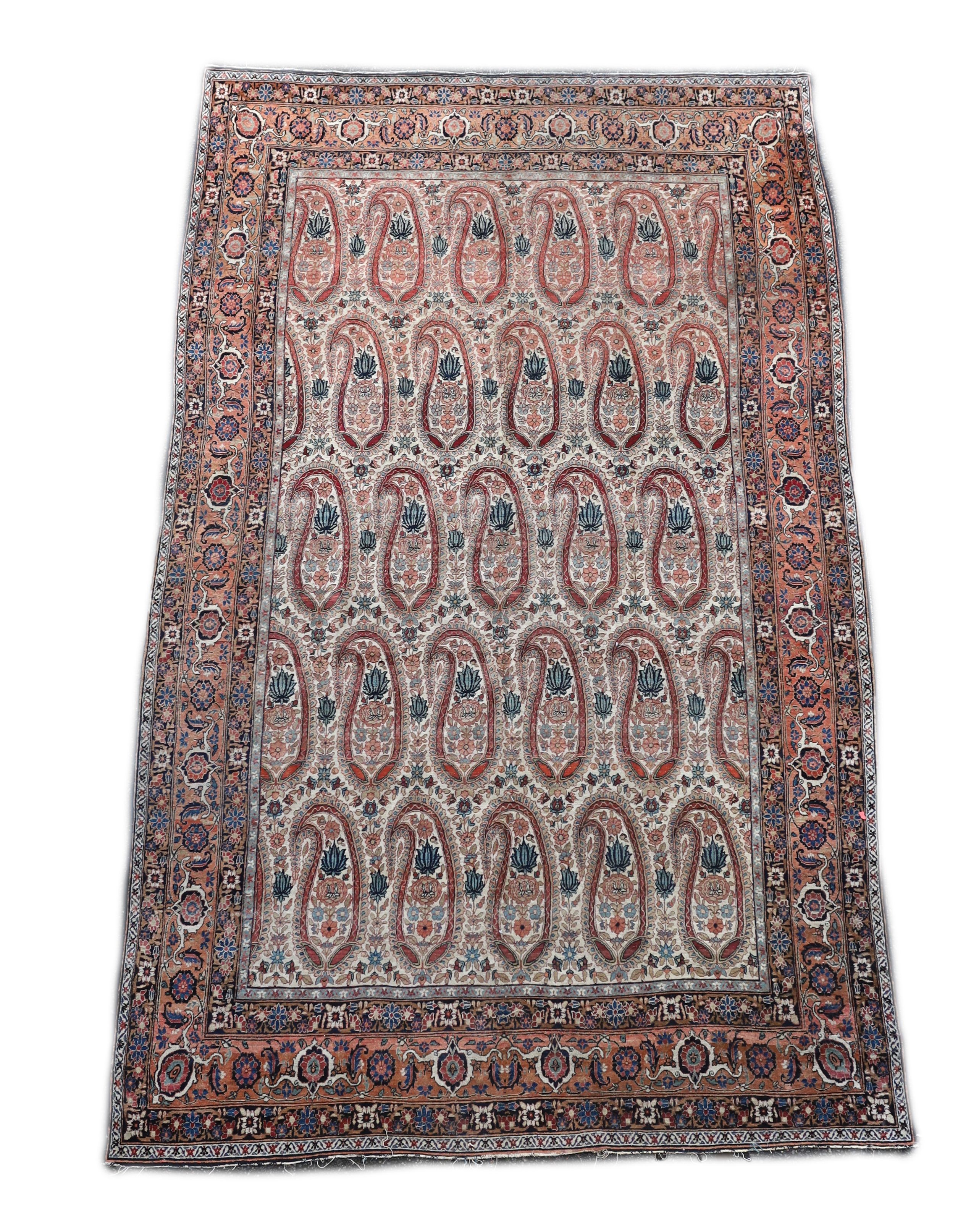 A Kerman rug ivory ground carpet, 360 x 218cm.